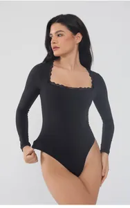 Elegant black long-sleeve bodysuit with lace trim square neck shown on model in studio