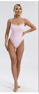 Detailed view of light pink lace-trimmed bodysuit featuring delicate thin spaghetti straps
