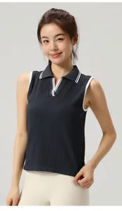 Detail of a dark navy sleeveless polo shirt with white trim for yoga and tennis