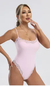 Detail of pink bodysuit featuring delicate lace trim and elegant dual spaghetti straps