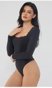 Slim fit black long-sleeved square-neck bodysuit featuring delicate lace trim on the neckline