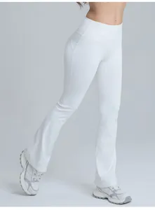 Detailed side view of white high-waisted flared yoga pants showing the peach butt lift design