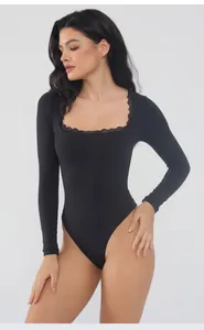 Elegant black bodysuit with long sleeves and delicate lace trim around the square neckline.