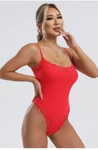 Detail view of red lace-trimmed bodysuit with delicate spaghetti straps