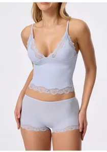 Elegant light blue lingerie set featuring lace trim camisole and matching boyshorts