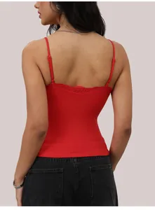 Back view of a red slim fit camisole with delicate lace trim and adjustable straps.