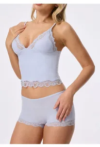 Detail of light blue lace lingerie set with camisole and matching boy-short panties