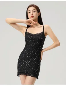 Close-up of black floral camisole dress with delicate lace trim and bodycon fit
