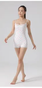 Detailed shot of a slim fit floral bodysuit with white lace trim and heart patterns