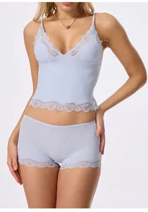 Detailed full shot of a light blue lace camisole and boy-short lingerie set for women