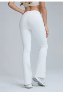 Back view of high-waisted white flared yoga pants showing a flattering peach lift fit