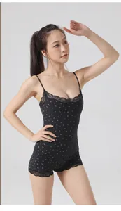 Black floral lace bodysuit with thin straps and a slimming feminine silhouette