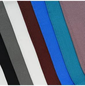 Detailed view of various colors and ribbed fabric texture for high-waist yoga leggings.
