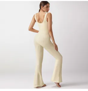 Back view of a premium ribbed cream U-neck flared yoga jumpsuit showing wide straps