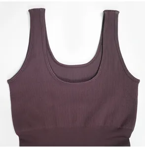 Macro view of dark purple ribbed U-neck tank top featuring wide shoulder straps for yoga