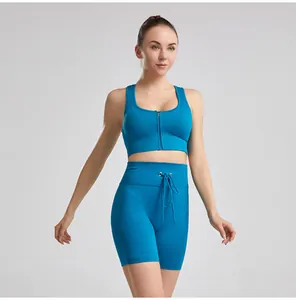 Detail view of blue ribbed yoga set with front zipper bra and drawstring shorts