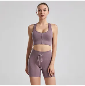 Close-up of mauve ribbed yoga set featuring front-zip bra and drawstring shorts