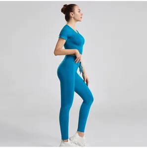 Side view of ribbed blue yoga set featuring drawstring waist and tight athletic fit