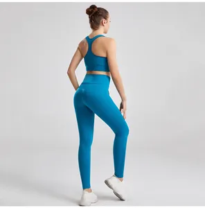 Rear view detail of a ribbed blue yoga set featuring a racerback bra and high-waist leggings
