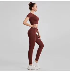 Side profile of a reddish-brown ribbed yoga set with drawstring high-waisted leggings.