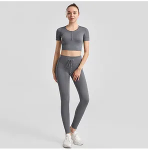 Close-up of a woman in a gray ribbed yoga set with drawstring leggings