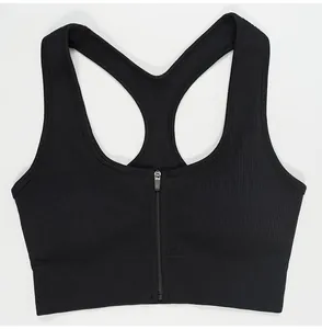 Detail of black ribbed sports bra with front zipper and racerback design.