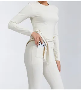 Detailed shot of breathable high-waist yoga leggings featuring a functional side phone pocket