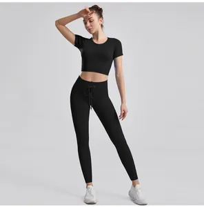 Detail showing black ribbed workout set with drawstring waist and high-stretch fabric