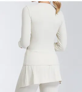 Detail view showing the back profile of a slim-fit cream yoga long-sleeve top for women
