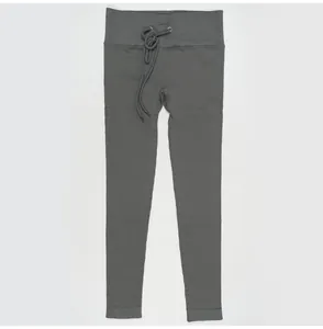 Close-up of dark grey ribbed yoga leggings featuring a functional drawstring waistband