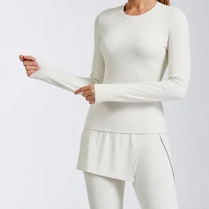 Women's tight yoga set with long sleeve top and breathable leggings in cream white