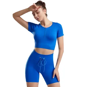 Two-piece seamless blue ribbed yoga set with short sleeve zipper top and shorts