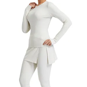 Women's ivory white tight yoga set featuring long-sleeve top and skirted leggings set