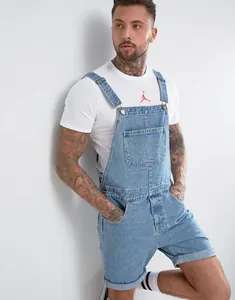Close-up of vintage men's light blue denim short overalls with front pocket detail