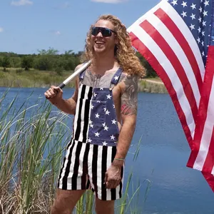 Detail shot of men's patriotic American flag pattern bib shorts in outdoor setting.