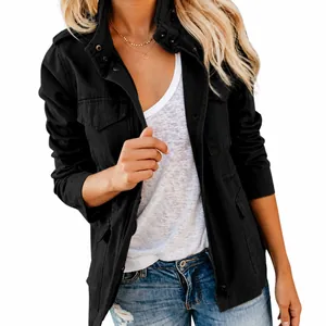 Close-up detail of women's black solid color multi-pocket jacket with zipper closure.