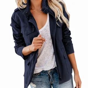Detailed view of women's navy blue utility jacket with multiple pockets and zipper