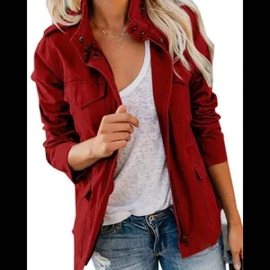 Detailed view of women's red slim-fit jacket with zipper and multi-pocket design