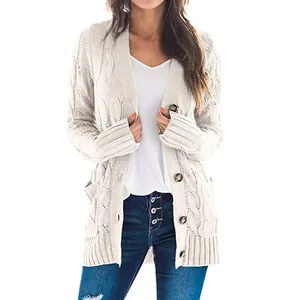 Detailed view of women's beige cable-knit cardigan sweater featuring button closure and pockets