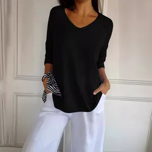 Elegant women's casual black V-neck knitted sweater with half sleeves and relaxed fit