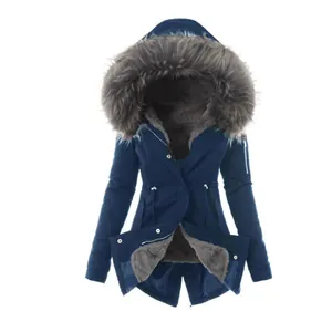 Detailed view of a women's navy winter parka with a large grey faux fur hood and fleece lining.