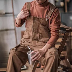 Retro brown men's loose work bib overalls featuring adjustable straps and utility pockets