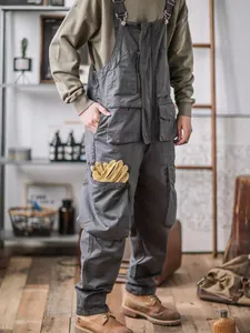 Men's vintage gray workwear bib pants with multi-pocket design and loose fit style