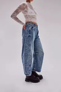 Side view showing the fit of vintage washed wide-leg denim jeans for women now