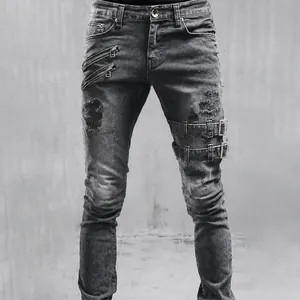Detailed view of men's distressed biker jeans with decorative zippers and buckles