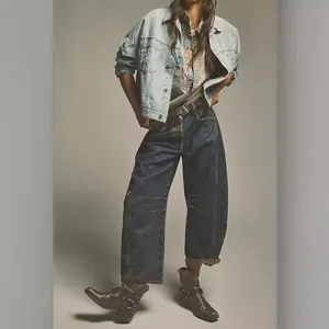 Professional women's loose wide leg washed denim jeans in a trendy vintage oversized fit.