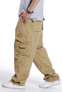 Side view detail of men's loose khaki cargo pants with multi-pockets