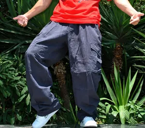 Detail shot of loose-fit wide-leg cargo pants for men in a trendy hip hop plus size style