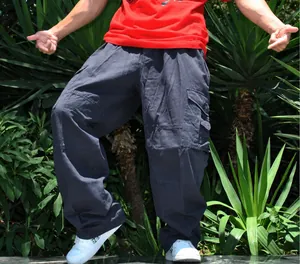 Detail shot of loose-fit wide-leg cargo pants for men in a trendy hip hop plus size style