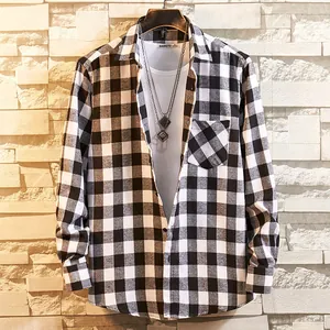 Detail shot of a men's classic black and white checkered flannel long-sleeve shirt